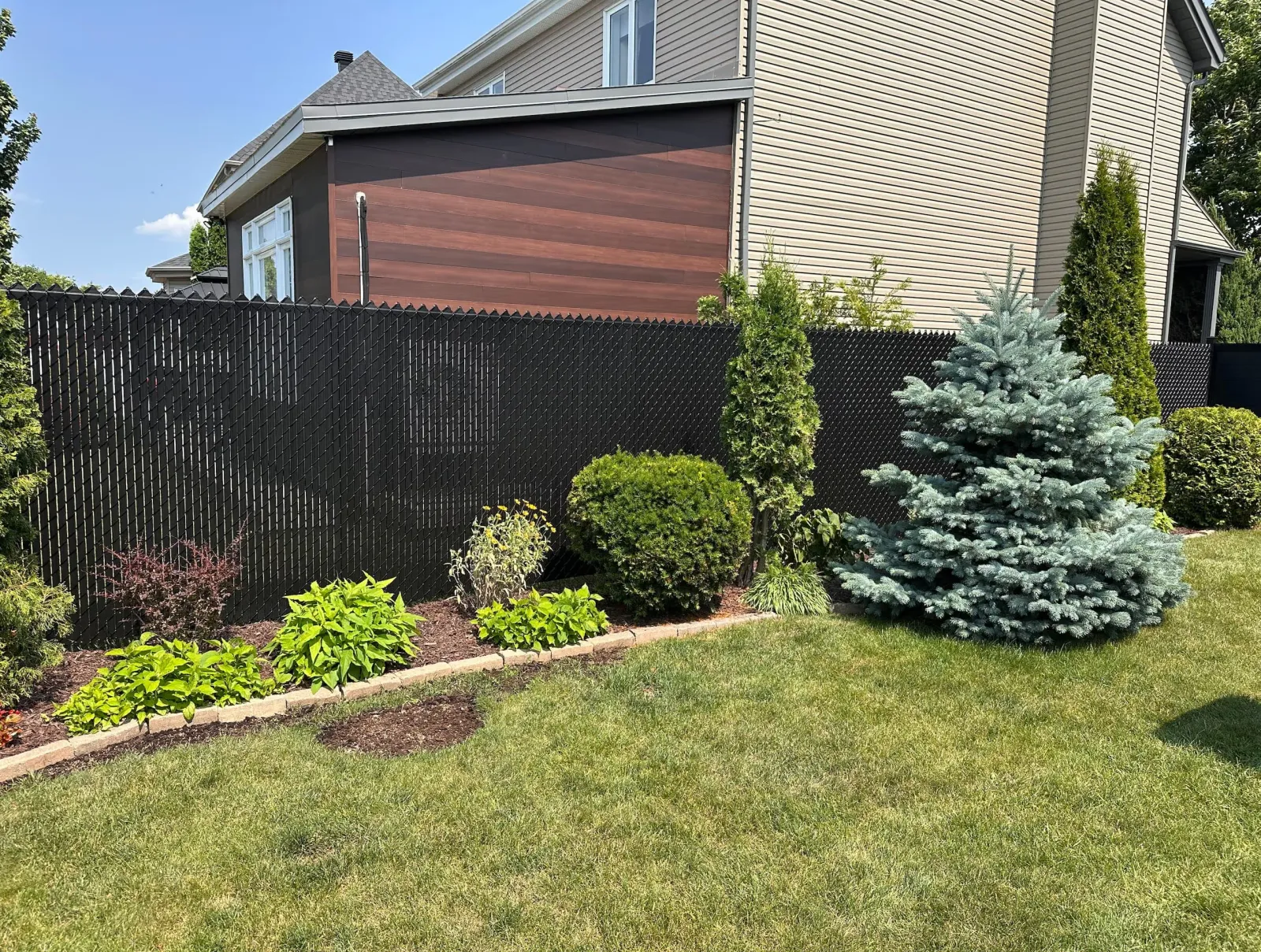 Chain link fence with black privacy slats